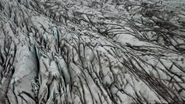 Glacier in Iceland with drone video close up moving from above.