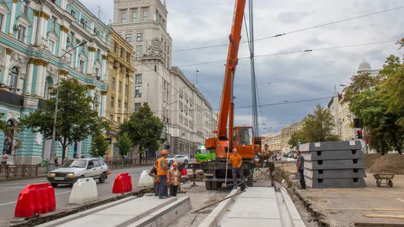 Installing Concrete Plates By Crane at Road Construction Site Timelapse.