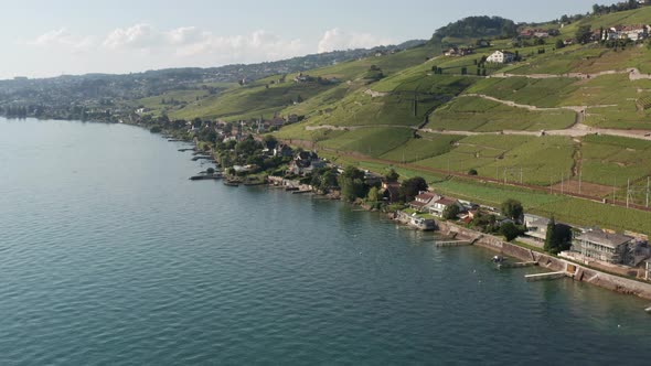 Flying from lake Geneva towards beautiful lakeside houses in Switzerland