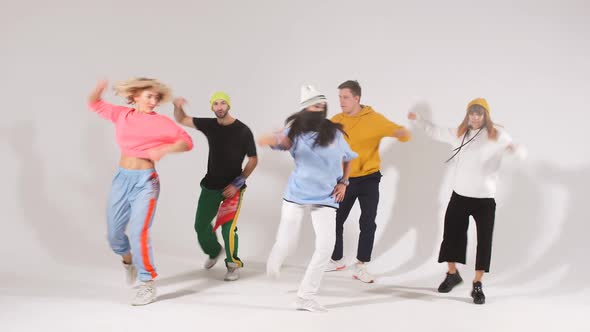 Portrait of Dancing Playful Teenagers Wearing Sporty Clothes