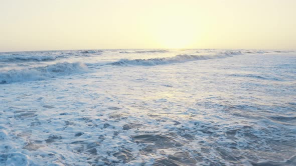 Aerial Drone View of Waves Foaming and Splashing in the Sea