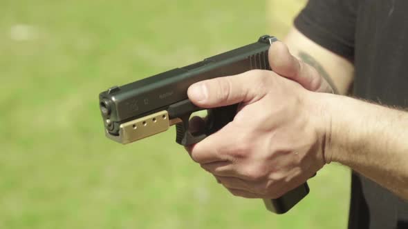 Close-up Shot of a Pistol. Slow Motion.