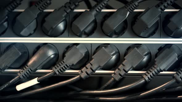 Electrical Wires Power Cord In  Cluster Rack Panel.Plugged Power Cables In Telecommunications Cloud