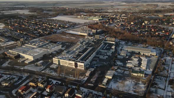 Modern Industrial Factory Near Residential Area in European City Aerial View