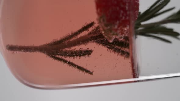 Vertical video, Close-up of sparkling champagne being poured into a glass; bubbles in a glass