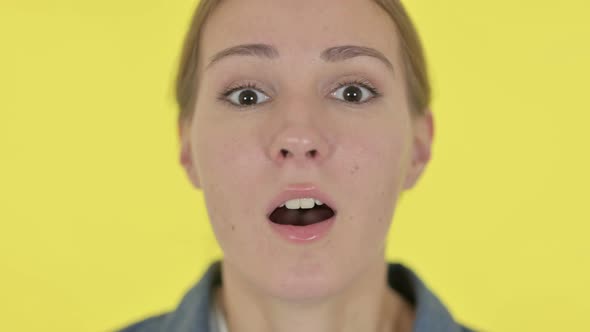 Face Close Up of Young Woman Looking Shocked at Camera