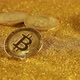 Bitcoin Falls on a Table With a Pile of Golden Sand - VideoHive Item for Sale