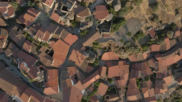 Monsanto village at sunset, Portugal. Aerial top-down lowering