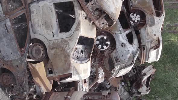 Vertical Video Irpin Ukraine  Burnt and Destroyed Cars