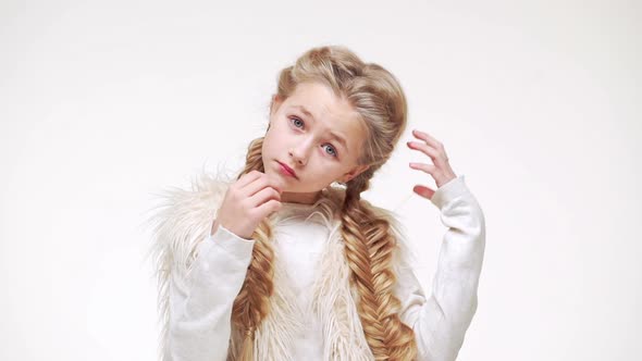 Young Gorgeous Caucasian Girl with Long Luxurious Blonde Hair Standing on White Background and