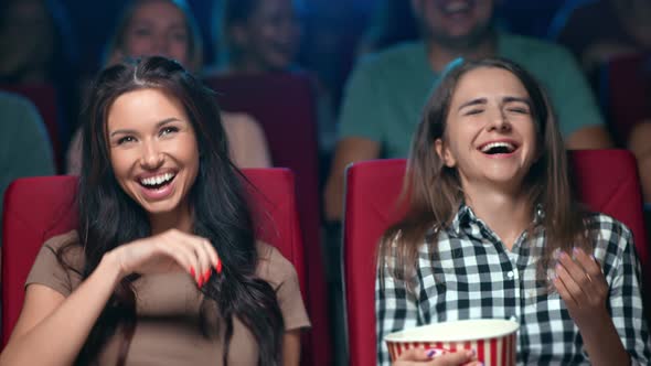 Two Laughing Female Friend Eating Popcorn Watching Comedy Film Cinema Rejoicing Having Fun