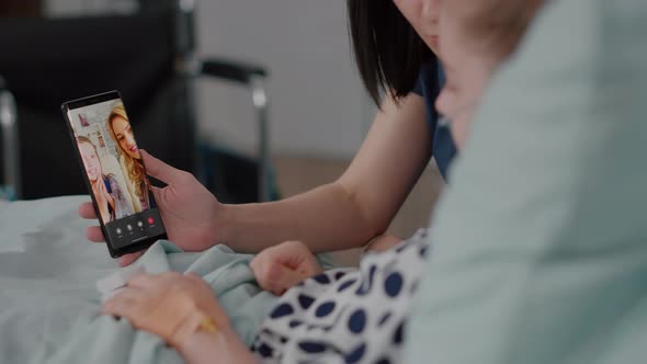 Mother with Sick Daughter Having Online Videocall Meeting Conference