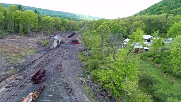 Aerial View of an Abandoned Narrow Gauge Coal Rail Road with Rusting Hoppers and Freight