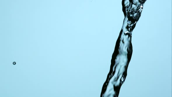 Water pouring and splashing in ultra slow motion 1500fps on a reflective surface - WATER POURS