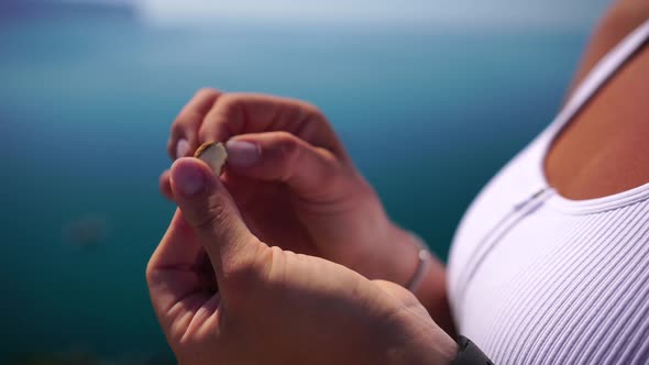 Woman Eating Milky Almond Nuts