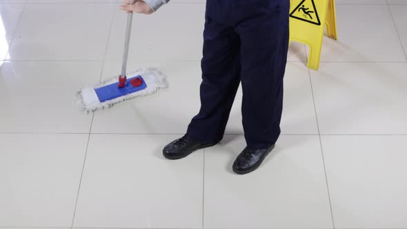 Cleaner With Broom Sweeping Floor And Cleaning Mopping