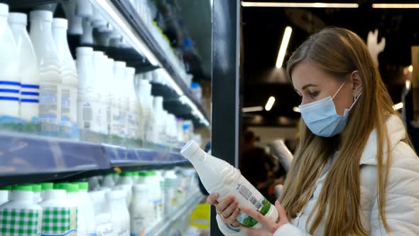 Woman Studies the Composition of Milk