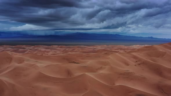 Sand Dunes with Storm Clouds in Gobi Desert