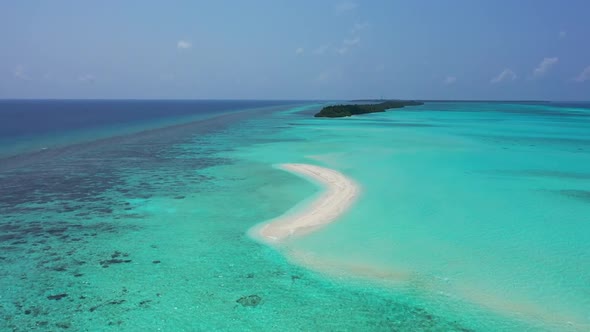 Aerial drone shot tourism of tropical coastline beach journey by blue water with white sand backgrou