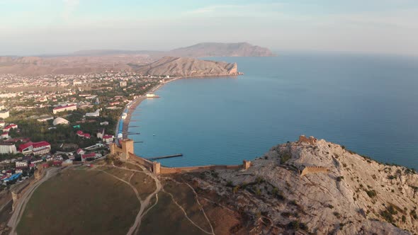 Aerial Landscape Genoese Fortress on Mountain Top, Black Sea Shore and Sudak City. Ancient Fortress