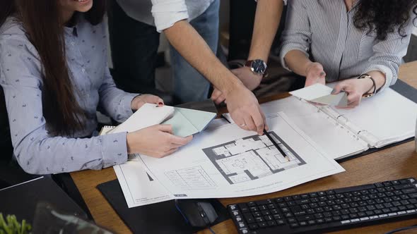 Three Architects Creating New Project in the Office