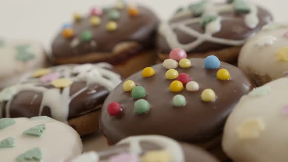 Assorted cookies with sprinkles shallow DOF 4K 2160p 30fps UltraHD footage - Colorful teacakes stuff