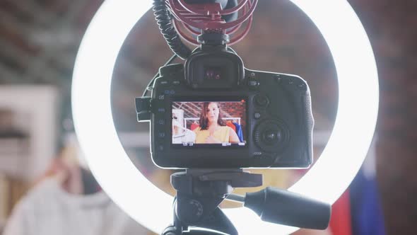 Caucasian vlogger woman doing a fashion video at home