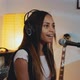 Close-up of Beautiful Smiling Girl in Headphone Singing Her Favourite Song on the Rehearsal - VideoHive Item for Sale