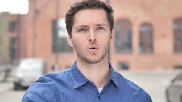 Angry Yelling Young Man Reacting to Problem Outside Office