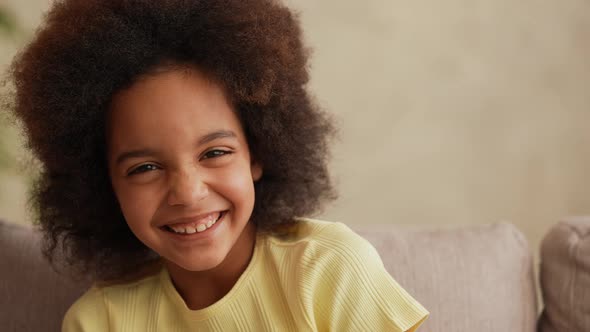 Portrait Little African American Girl Looking at the Camera and Laughing Cheerfully