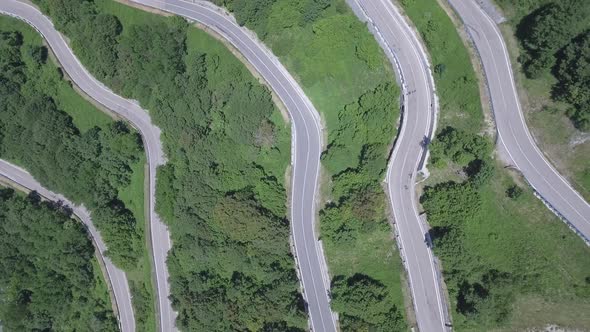 Aerial view of a winding mountain road in Italy