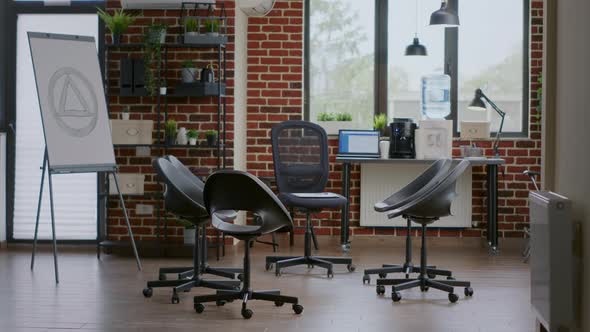 Nobody in Group Therapy Space Decorated with Chairs in Circle and Aa Meeting Sign on White Board