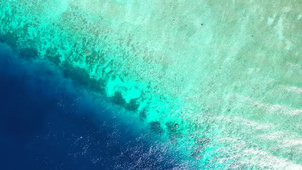 Aerial drone view texture of luxury seashore beach holiday by blue green sea and white sandy backgro