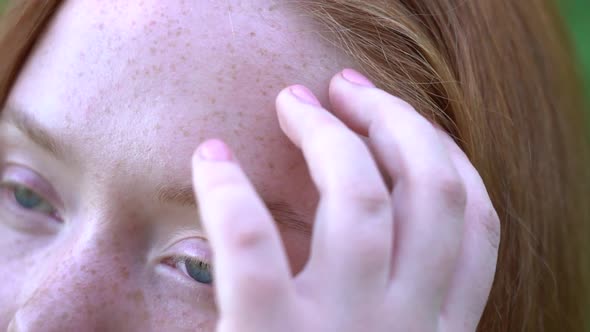 Redhead Young Girl Stroking Her Hair