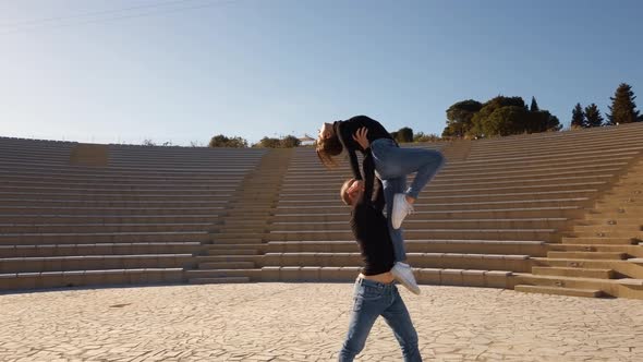 Dancers dance in an open-air theater