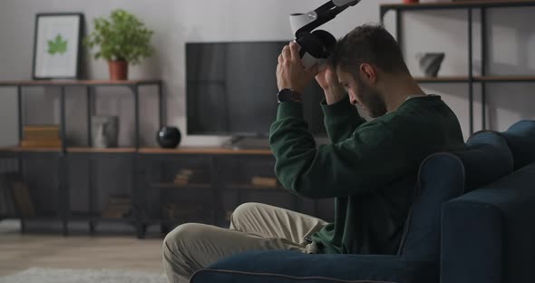 Man Is Wearing Vr Goggles at First Time Immersing Into Virtual World and Amazing Looking Around