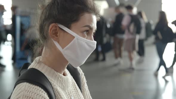 Two Women in Airport Terminal Waiting Checkpoint Prevent Themselves From Coronavirus