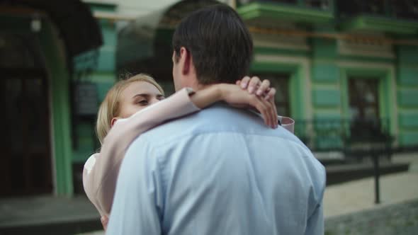 Lovely Couple Hugging in at Street. Man and Woman Standing Together Outdoors