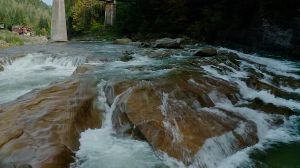 Aerial Drone View. Mountain River, Flying Over a Mountain Creek, Small Rocks with Rapids