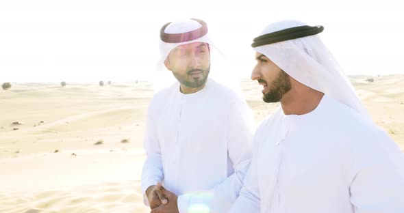 Men with traditional outfit  in the desert