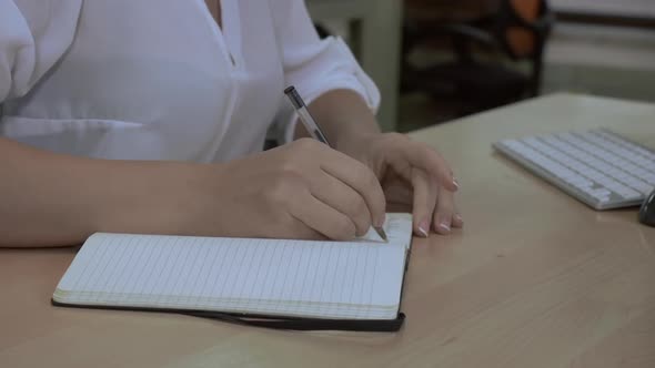 Unrecognizable Woman Keep Diary