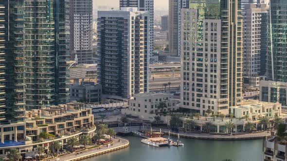 Beautiful Aerial View of Dubai Marina Promenade and Canal with Floating Yachts and Boats Before