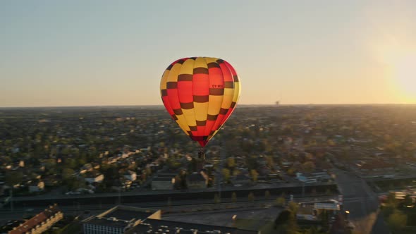 Orange Sky and Hot Air Balloon Floating During Sunset