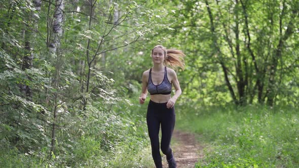 Running Girl Runs in Morning Park