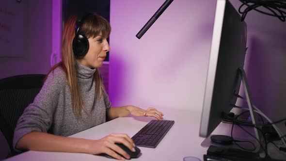 Side View Young Woman Live Streaming Playing Video Game at Pc