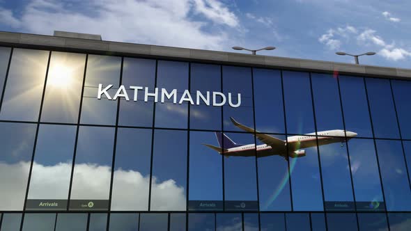 Airplane landing at Kathmandu Nepal airport mirrored in terminal