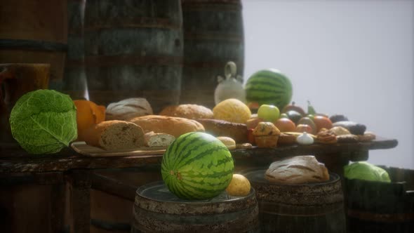 Food Table with Wine Barrels and Some Fruits Vegetables and Bread