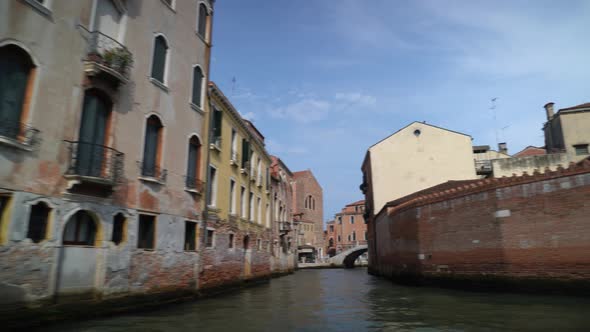 Grand Canal View Of Old Brick Buildings In Venice, Italy. POV, pan right