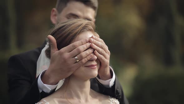 Newlyweds. Caucasian Groom with Bride in the Park. Wedding Couple. Happy Family