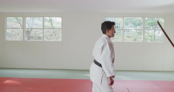 Judokas training with a wooden saber